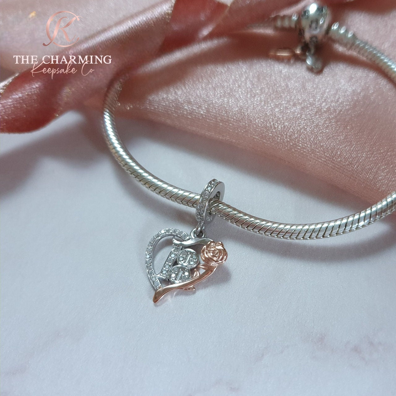 Rose gold pandora on sale bracelet with silver charms